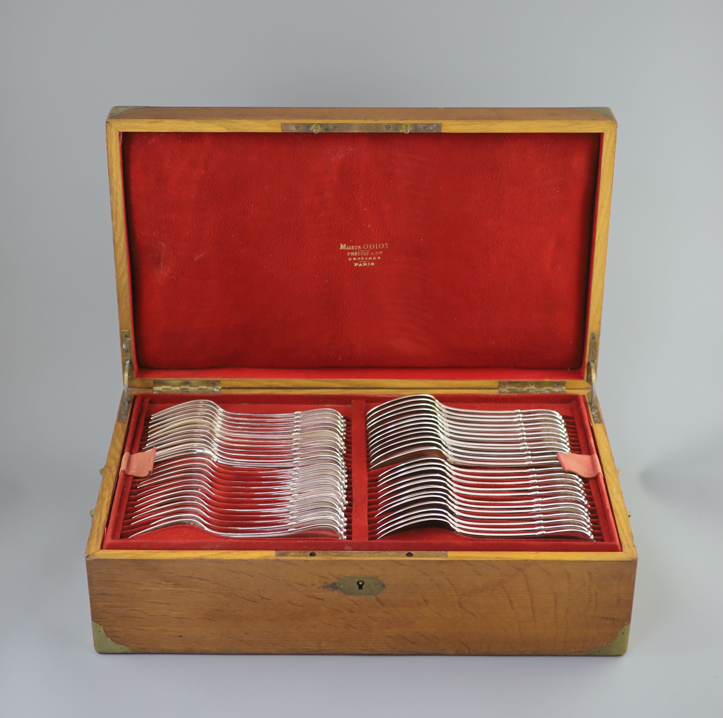 A late 19th century French canteen of silver 950 standard cutlery, in a brass mounted oak canteen, by Prevost Recipon & Cie (Maison Odiot)